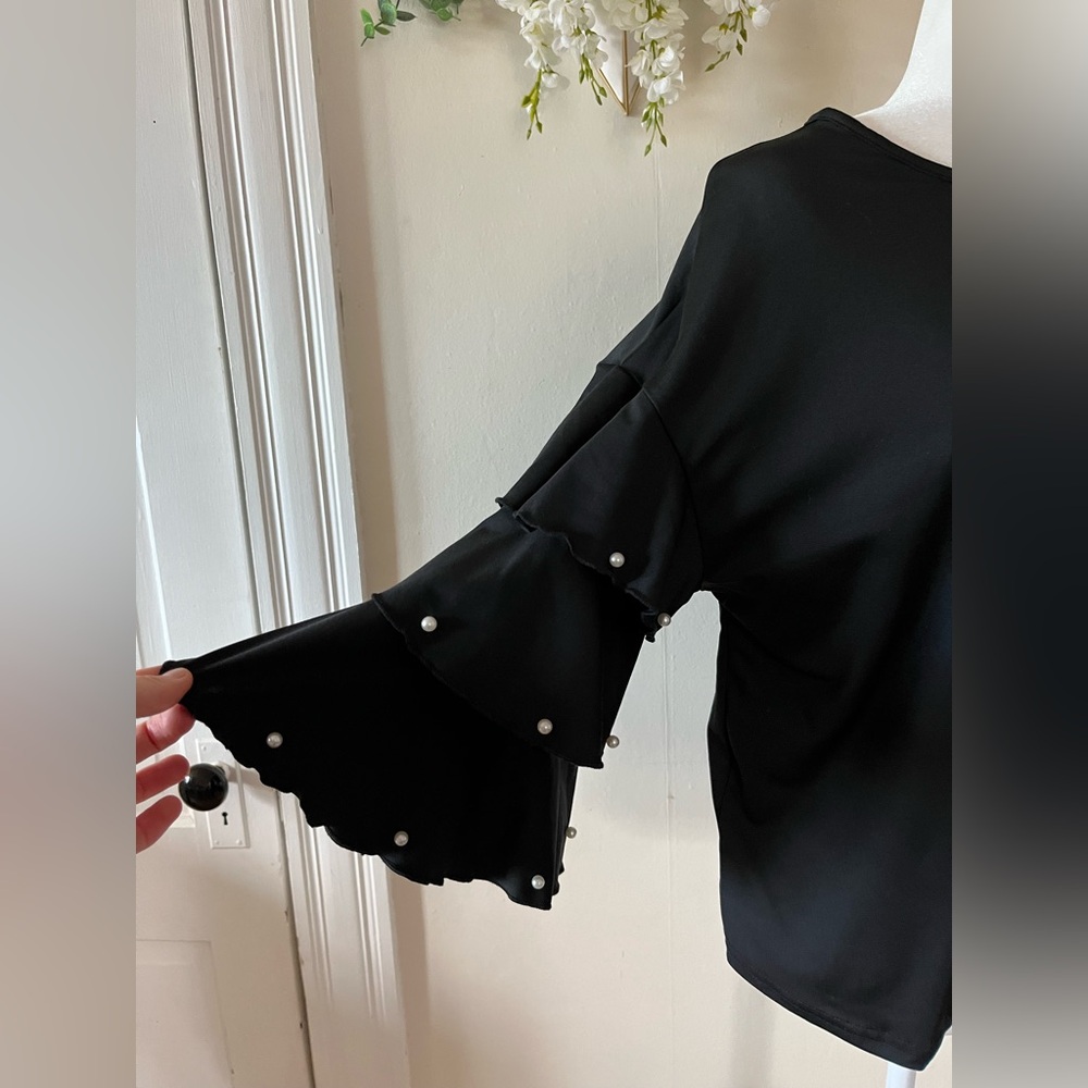 Bell sleeves with layers and decorations